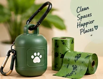 A green waste-bag dispenser with refill rolls. Clean spaces, happier places.